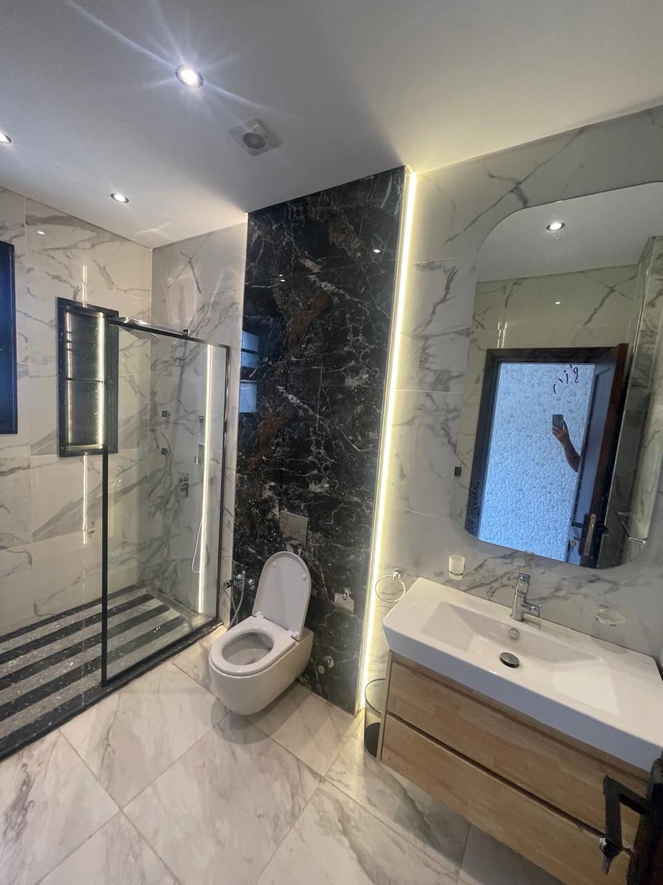 Bright Interiors finishing work: bathroom white marble