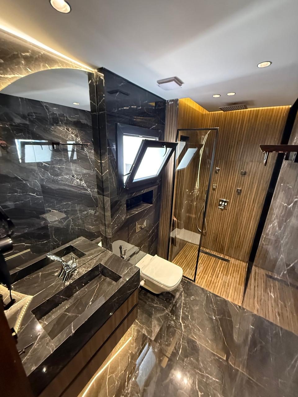 Bright Interiors finishing work: bathroom wood marble