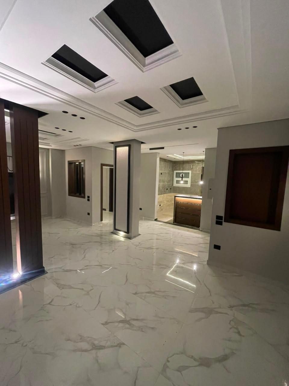 Bright Interiors finishing work: marble hall ceiling