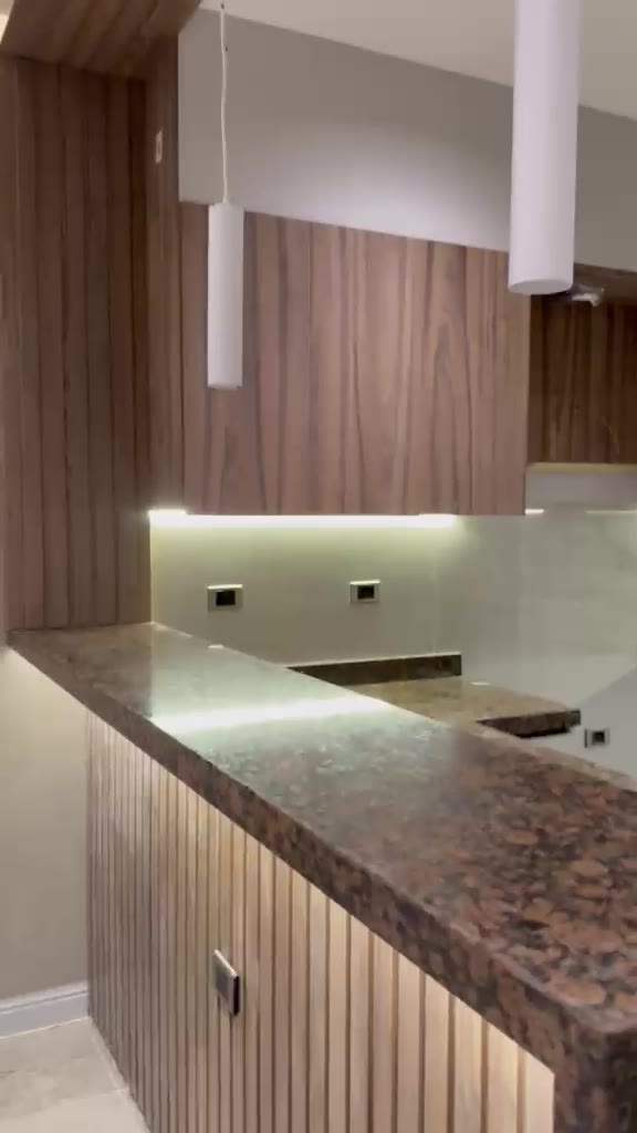 New fitted kitchen with granite counter and wood cabinets
