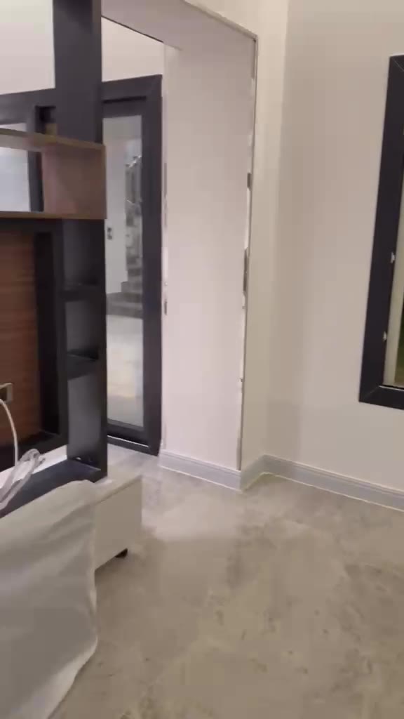 Renovated living area with large porcelain tiles