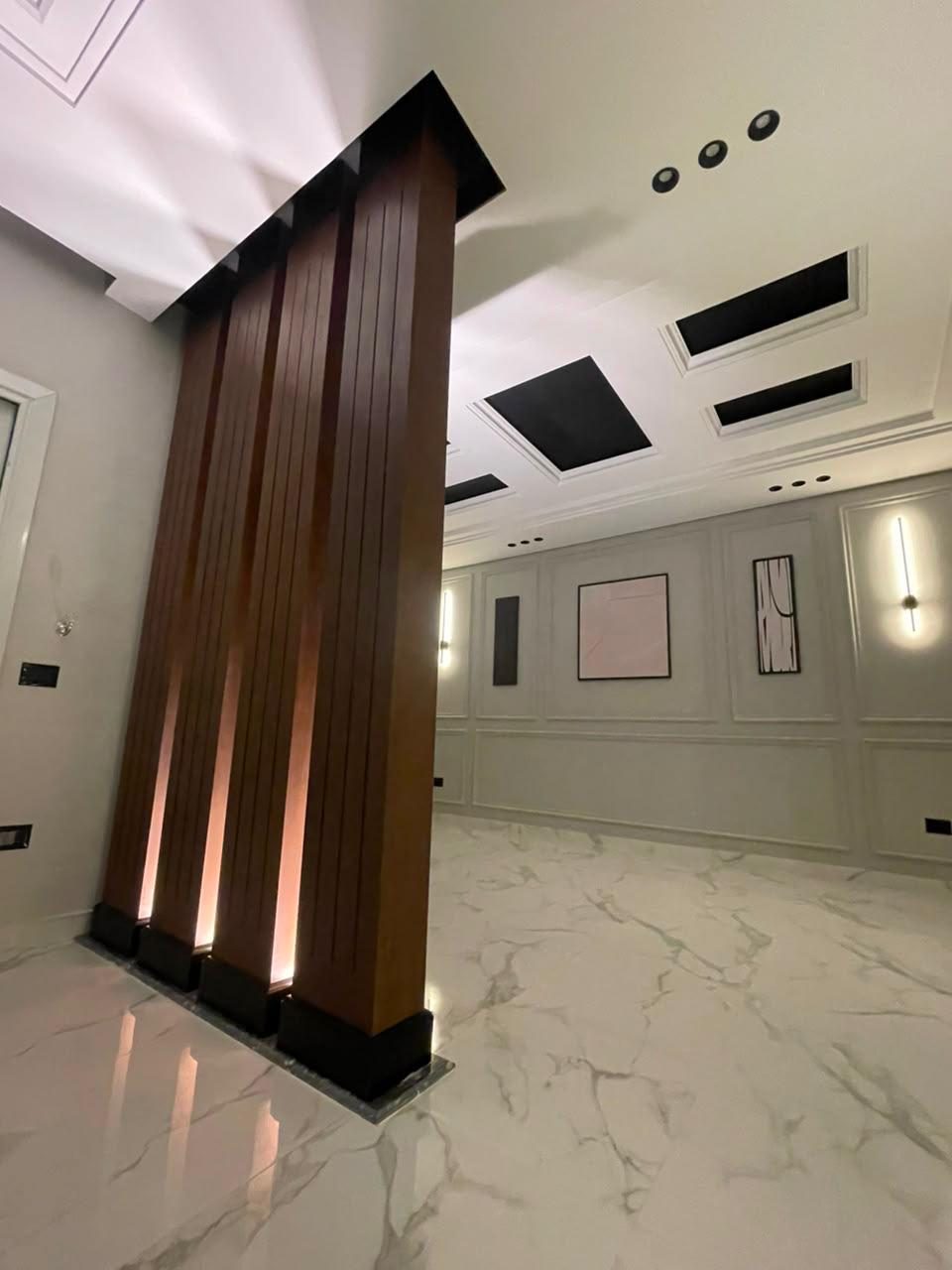 Bright Interiors finishing work: wood column hall